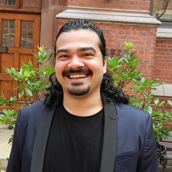 Photo of Kayhan Sanyal (man with facial hair and long hair)